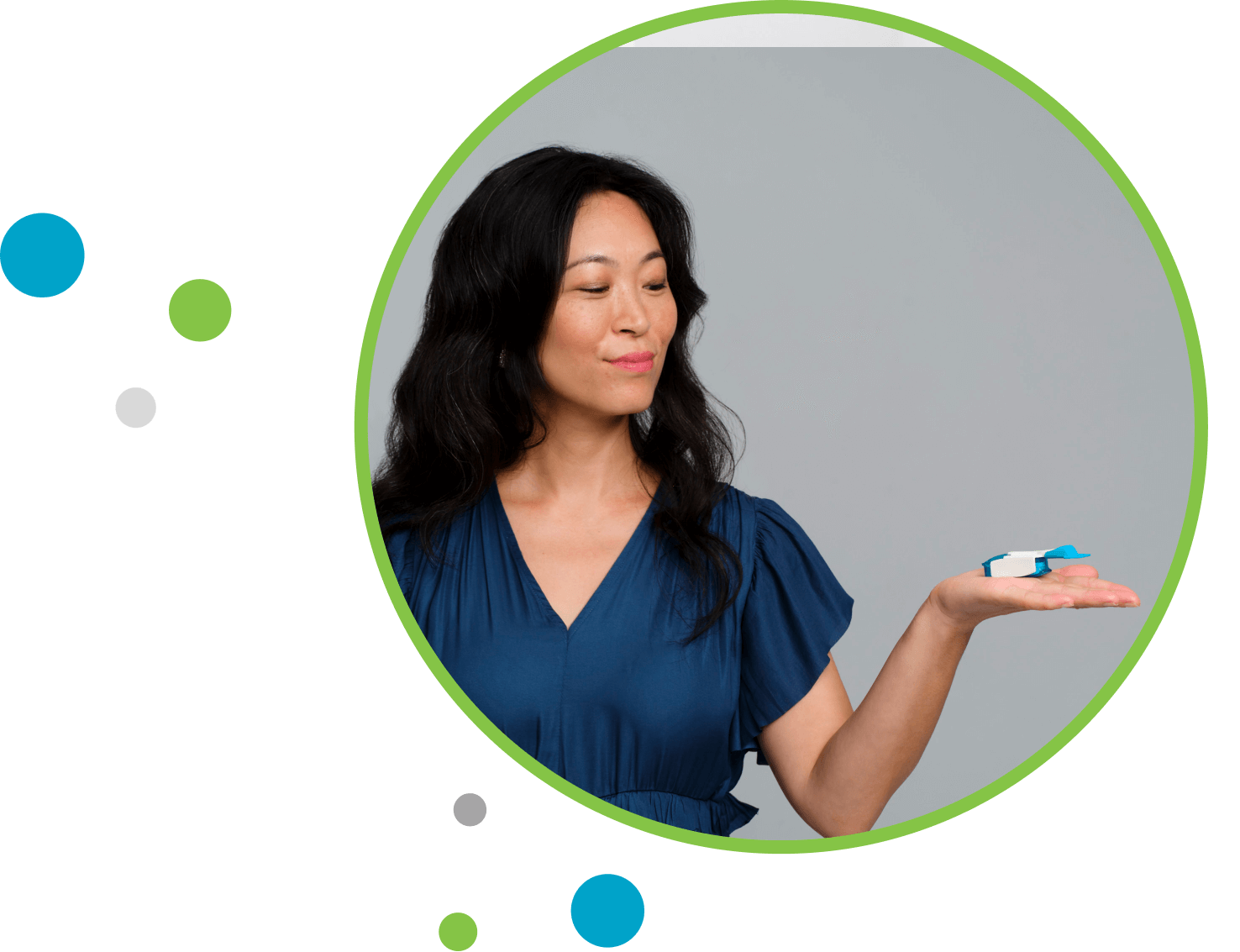 Woman holding TYVASO DPI in the palm of her hand